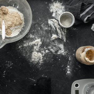 Top view of a counter with sourdough starter ingredients