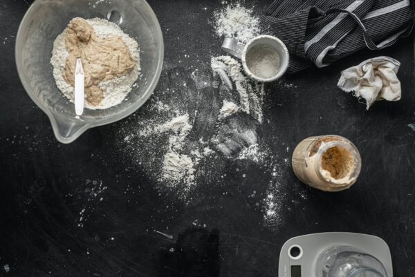 Top view of a counter with sourdough starter ingredients