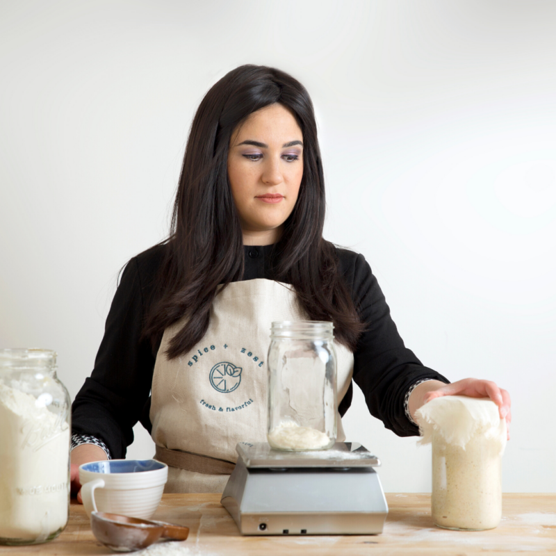 weighing flour and covering starter