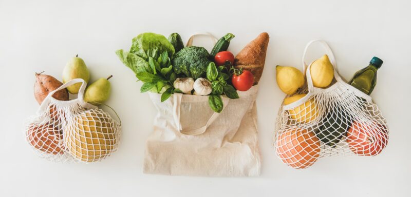 Top view of healthy vegetables and fruits in bags