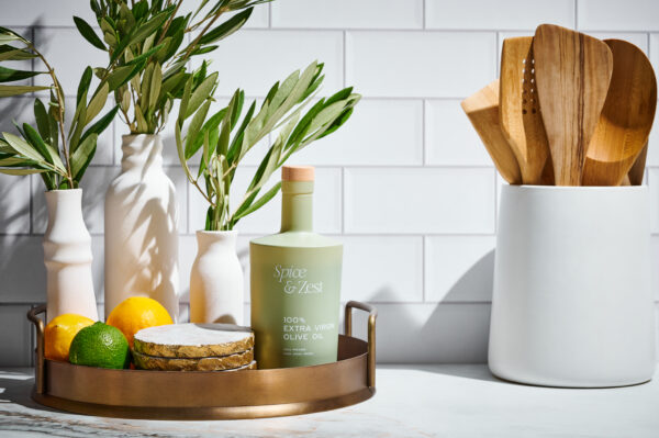 bottle sitting on a tray on kitchen counter alongside other aesthetic countertop accessories
